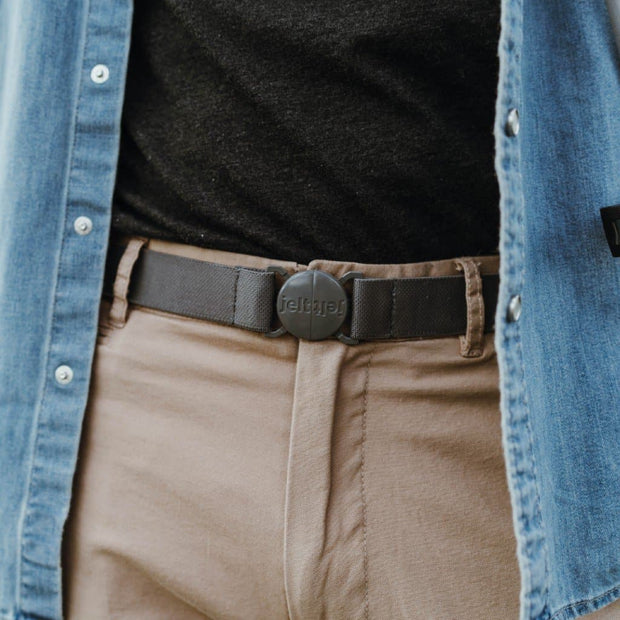Man in khakis with a denim shirt wearing the new limited edition, steel grey Jelt elastic belt.