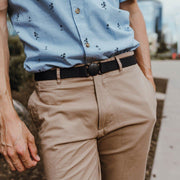 Man wearing denim navy blue Jelt elastic belt with khaki pants and a dress shirt